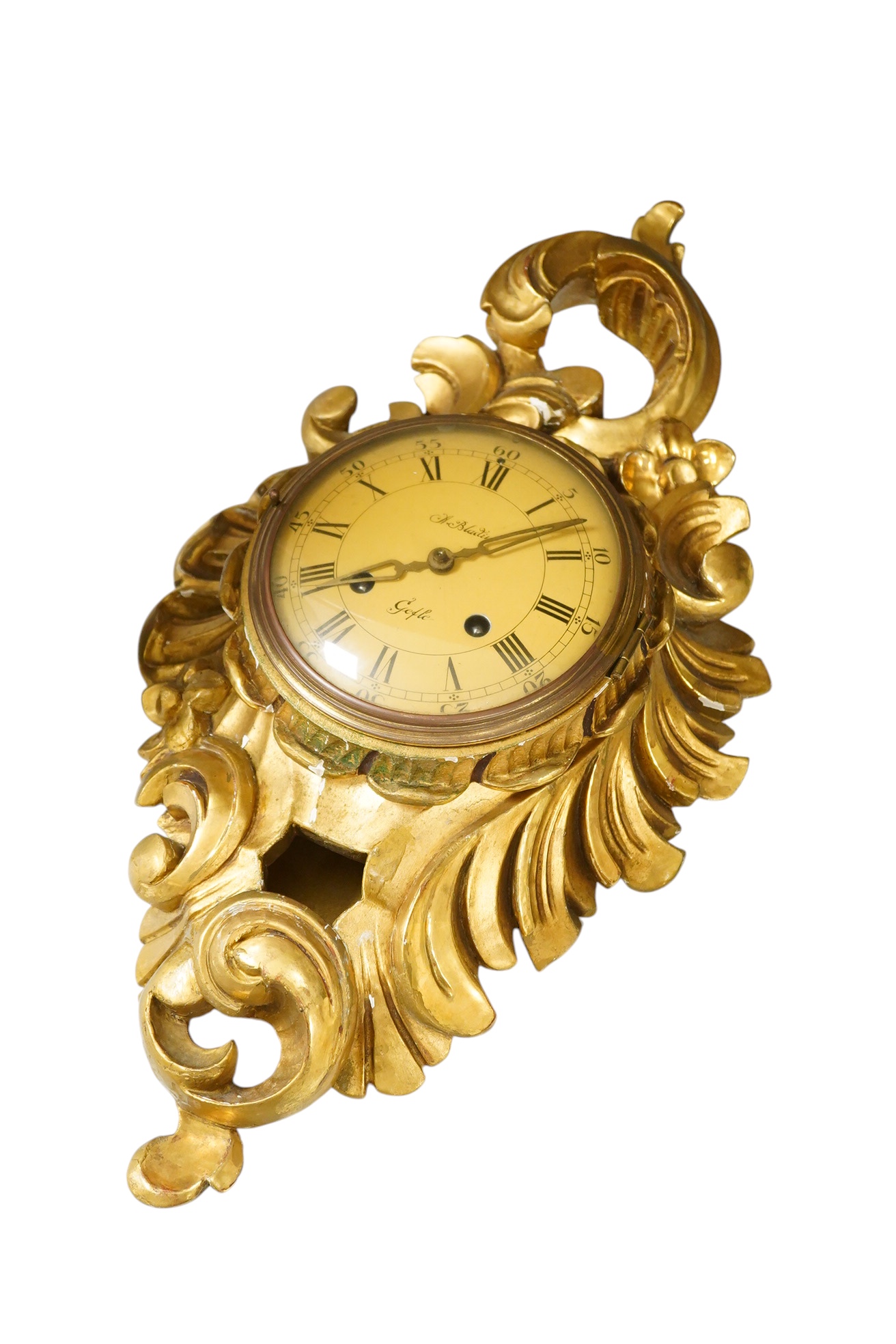 A carved giltwood cartel wall clock, 57 cm high